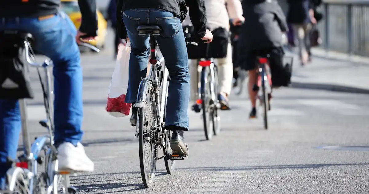 Cyclists biking in a bike lane