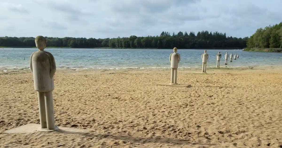 Statues leading into a lake in the Netherlands