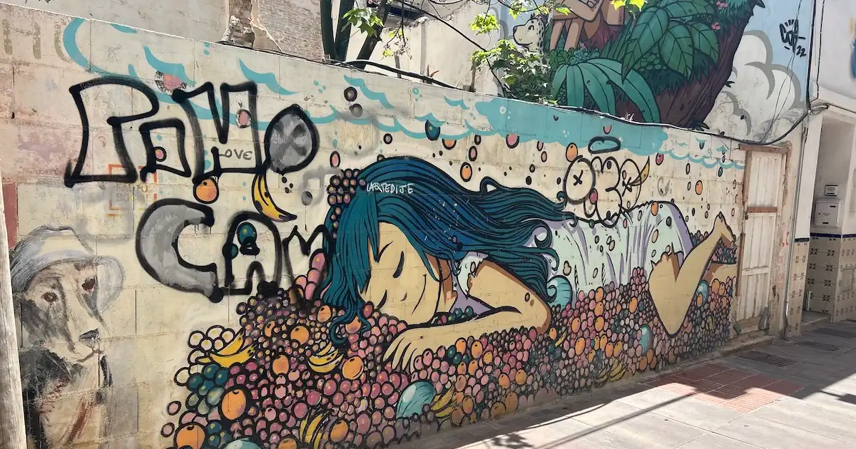 Street art showing a sleeping girl in Málaga, Spain